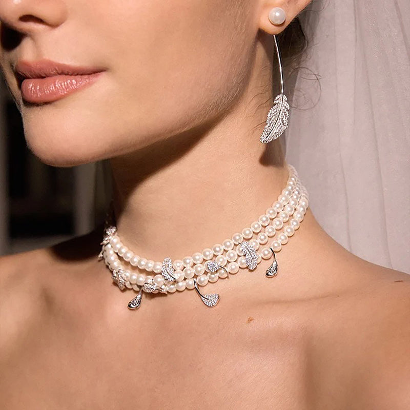 Adalhild White Pearl Feather Earrings