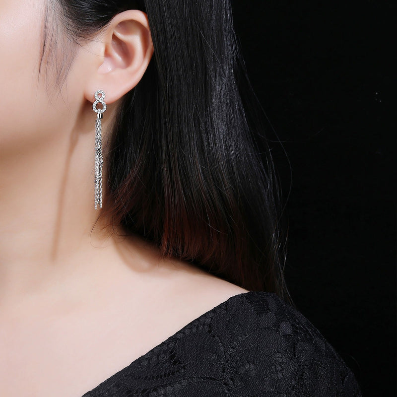 Hermine White Infinity Tassel Earrings